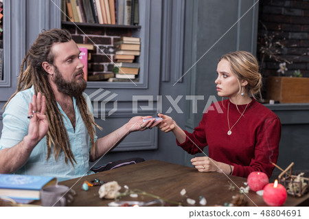 Nice young woman taking a tarot card 48804691