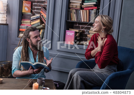 Delighted positive woman pressing hands to the chest 48804873