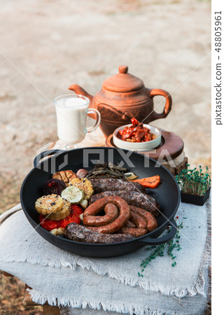 Grilled sausages with vegetables Grilled sausages with vegetables 48805961