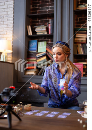 Nice blonde woman being a fortune teller 48806167