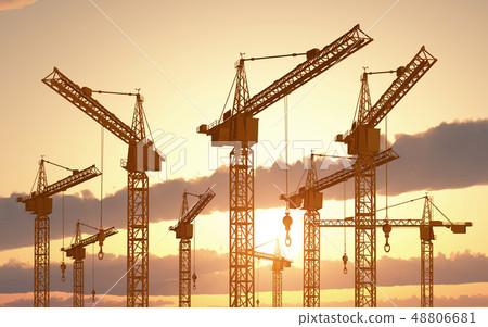 Construction cranes at sunset Construction cranes at sunset 48806681