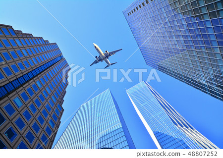 Jet aircraft flying over the skies of Seoul's landmarks, high-rise buildings 48807252
