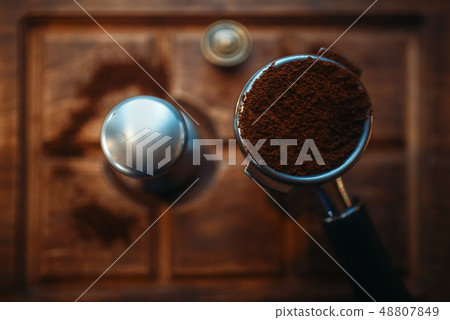 Turk with fresh ground coffee on wooden counter 48807849