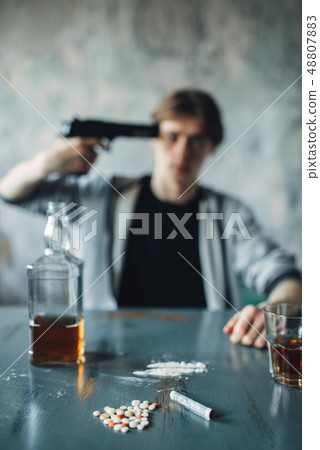 Stressed junkie put a gun to his temple 48807883