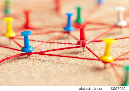 Business team. Connect between people. Office pins connected by red thread 48807981