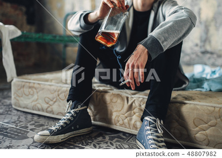 Addicted male person with cigarette and alcohol Addicted male person with cigarette and alcohol 48807982