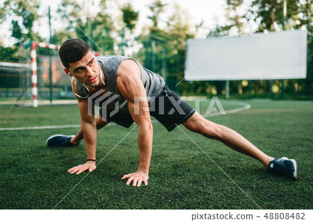 Stretching exercise on outdoor fitness workout 48808482