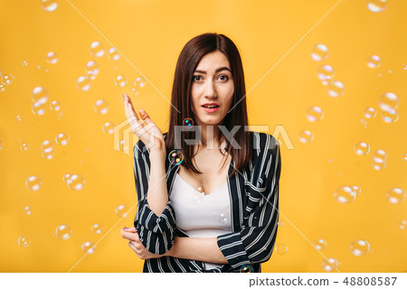 Pretty woman and soap bubble around Pretty woman and soap bubble around 48808587