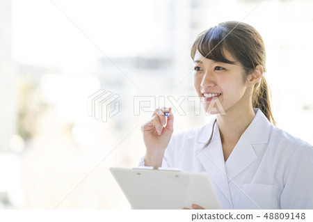 Angel female nurse in white coat smiling pretty 48809148