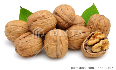 Walnut and cracked walnut with leaf isolated 48809597