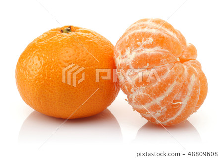 Whole and peeled mandarin fruits isolated 48809608