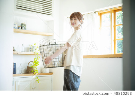 Woman with laundry 48810298