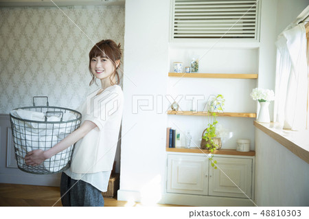 Woman with laundry 48810303