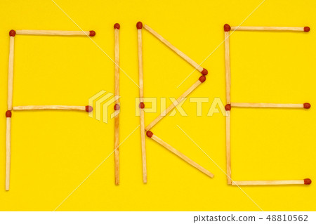 Word FIRE made with matches 48810562