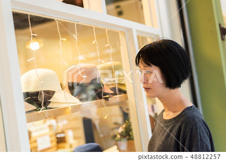 woman look into the store 48812257