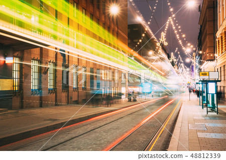 Helsinki, Finland. Tram Departs In Motion Blur From Stop On Aleksanterinkatu Street In Kluuvi Helsinki, Finland. Tram Departs In Motion Blur From Stop On Aleksanterinkatu Street In Kluuvi 48812339