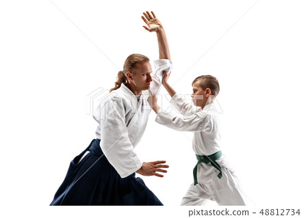 Man and teen boy fighting at aikido training in martial arts school 48812734