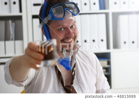 Man wearing suit and tie in goggles and snorkel Man wearing suit and tie in goggles and snorkel 48813089
