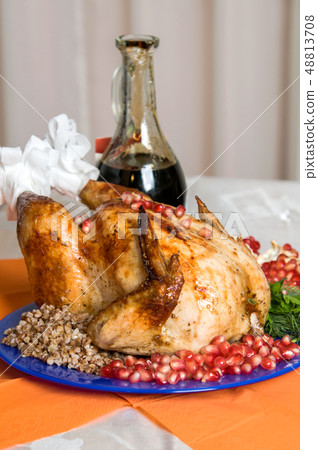 whole fried chicken with buckwheat and pomegranate 48813708
