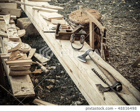 Old woodworking hand tool: wooden plane, chisel ax, and drawing knife in a carpentry workshop on 48816498
