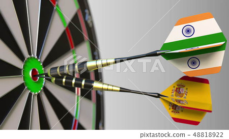 Flags of India and Spain on darts hitting bullseye of the target. International cooperation or Flags of India and Spain on darts hitting bullseye of the target. International cooperation or 48818922