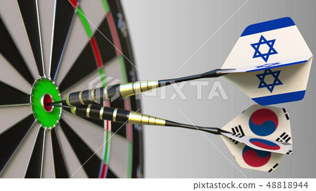 Flags of Israel and Korea on darts hitting bullseye of the target. International cooperation or 48818944