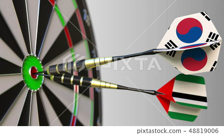 Flags of South Korea and the UAE on darts hitting bullseye of the target. International cooperation Flags of South Korea and the UAE on darts hitting bullseye of the target. International cooperation 48819006
