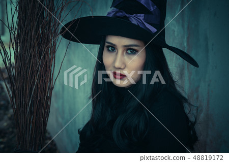 The witch and broomstick on dark background 48819172