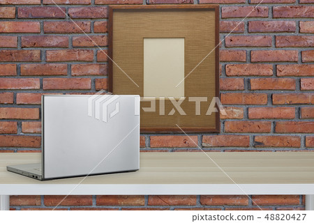 Computer with black screen on office table 48820427