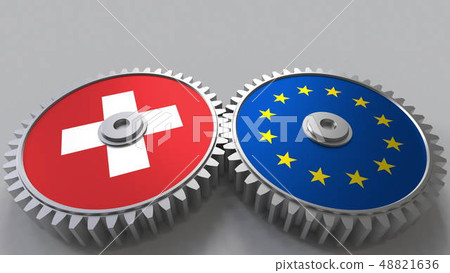 Flags of Switzerland and the European Union on meshing gears. International cooperation conceptual 48821636