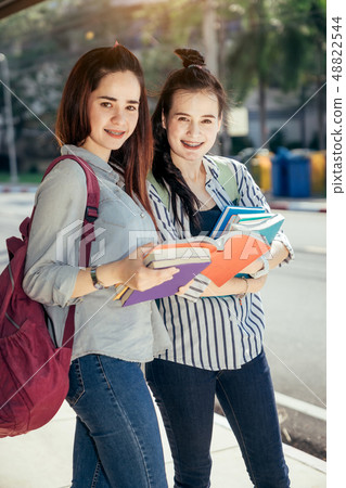 Teenage student in university. Teenage student in university. 48822544