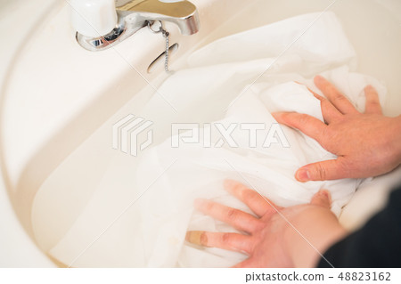 Laundry, shirt stain removal Laundry, shirt stain removal 48823162