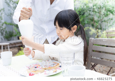 Family image Eating on the terrace Family image Eating on the terrace 48823275