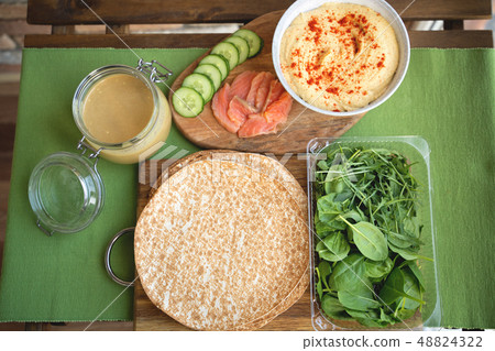 Healthy wraps with salmon and chickpeas for lunch. Love for a healthy food concept 48824322