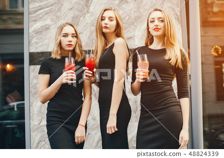 girls with cocktails 48824339