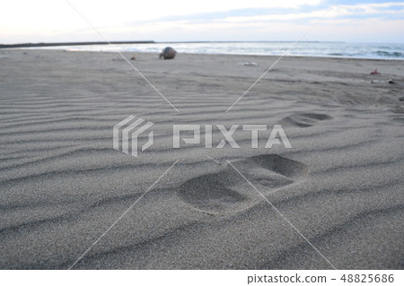 Sandy beach with footprints Sandy beach with footprints 48825686