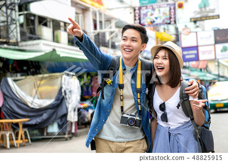 Young happy Asian couple tourist backpackers in 48825915
