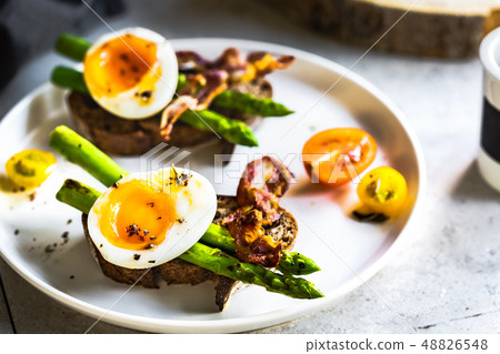 Bacon ,Seared Aspargus and Soft boiled egg  on Rye 48826548