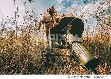 Reenactors Dressed As Russian Soviet Red Army Soldiers Of World War II Walking With With Maxim's 48826560