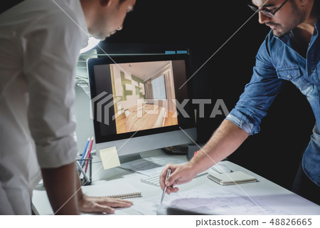 Architect team discussing project at night Architect team discussing project at night 48826665