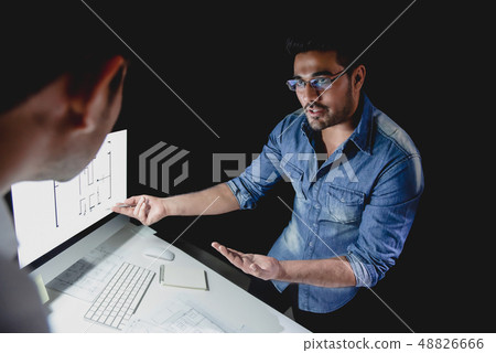 Architect team discussing project at night Architect team discussing project at night 48826666