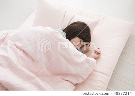  A woman sleeping 48827214