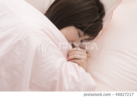 A woman sleeping A woman sleeping 48827217