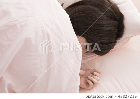 A woman sleeping A woman sleeping 48827219