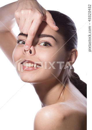 Young woman smiling making pig funny face 48828482