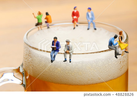 People talking with mugs of beer People talking with mugs of beer 48828826