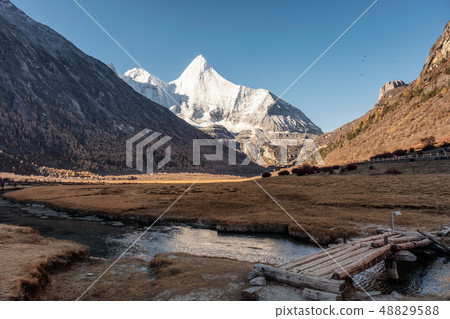 Sacred snow mountain Yangmaiyong reflection on 48829588