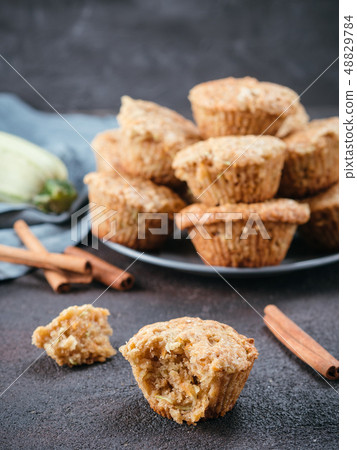 Muffins with zucchini, carrots, apple and cinnamon 48829784