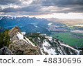 Scenic landscape overlooking snowy mountains 48830696