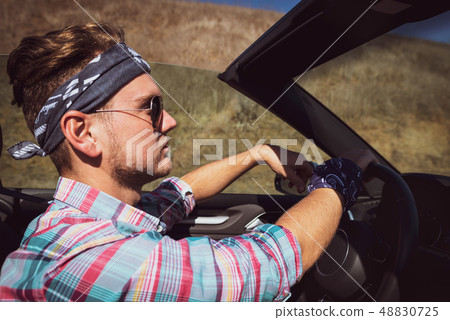 Stylish man in headband and colorful shirt 48830725
